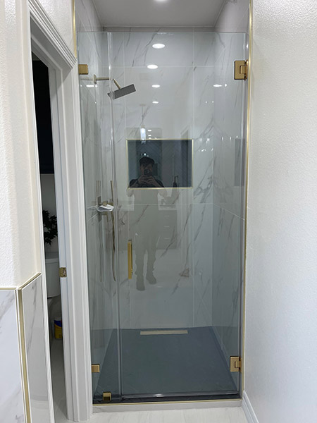 Frameless Shower Door with Small - Stationary Panel - Brass Hardware